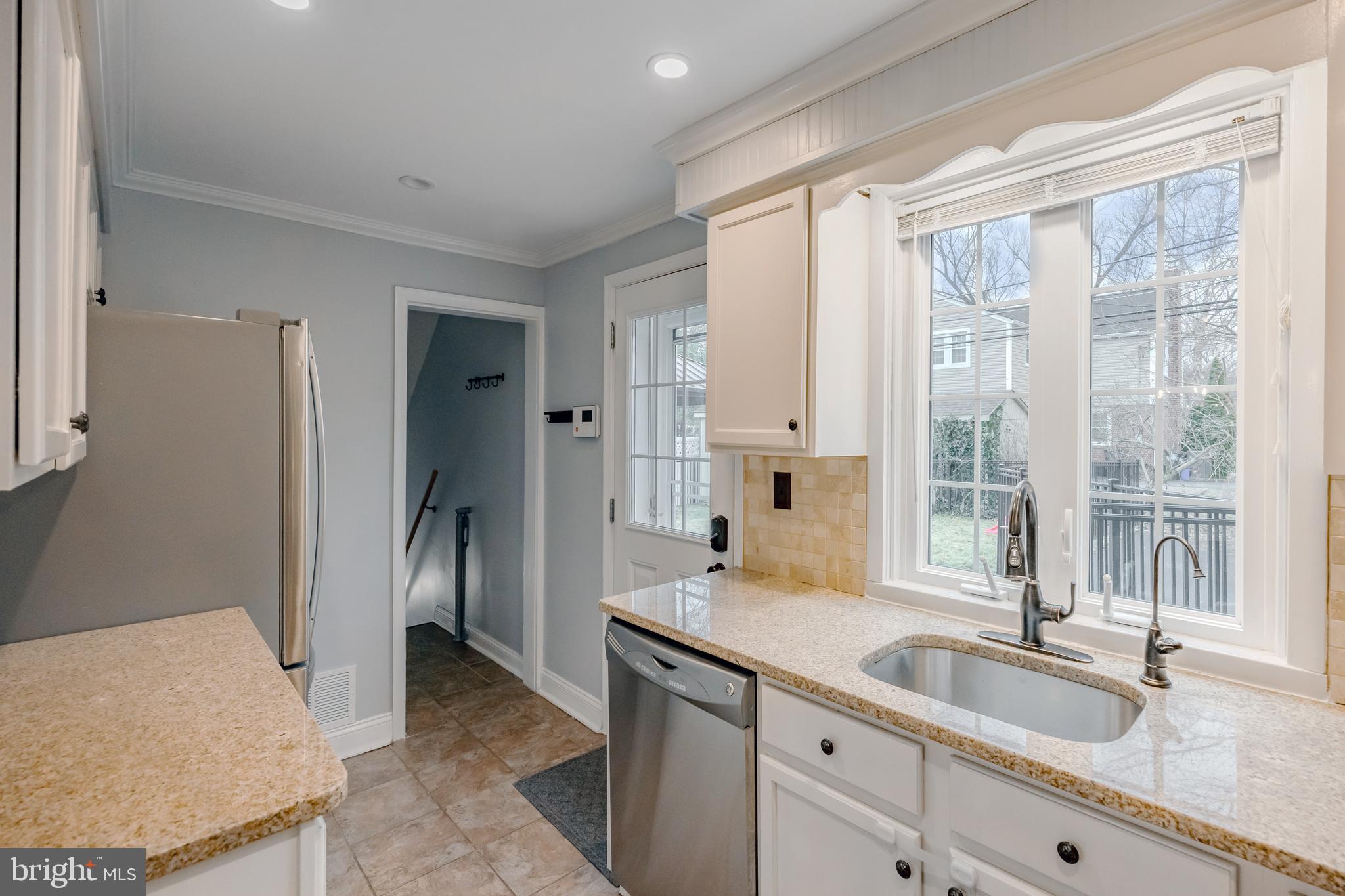 216 Earlington Road Havertown, PA 19083 - Photo 13 of 26 a spacious bathroom with a granite countertop sink and a large mirror