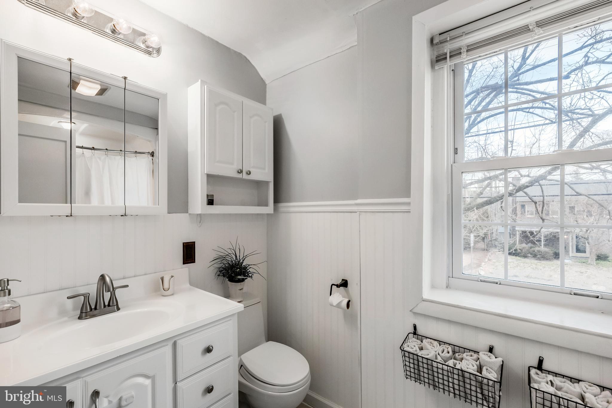 216 Earlington Road Havertown, PA 19083 - Photo 18 of 26 a bathroom with a sink a toilet and a window