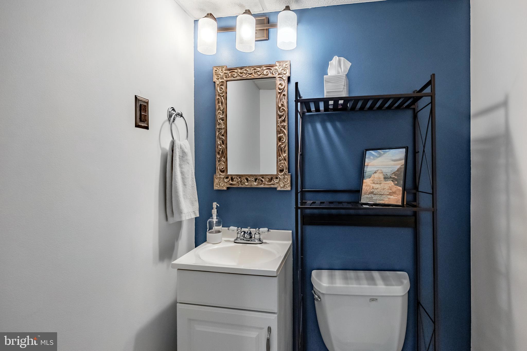 216 Earlington Road Havertown, PA 19083 - Photo 21 of 26 a bathroom with a toilet sink and mirror