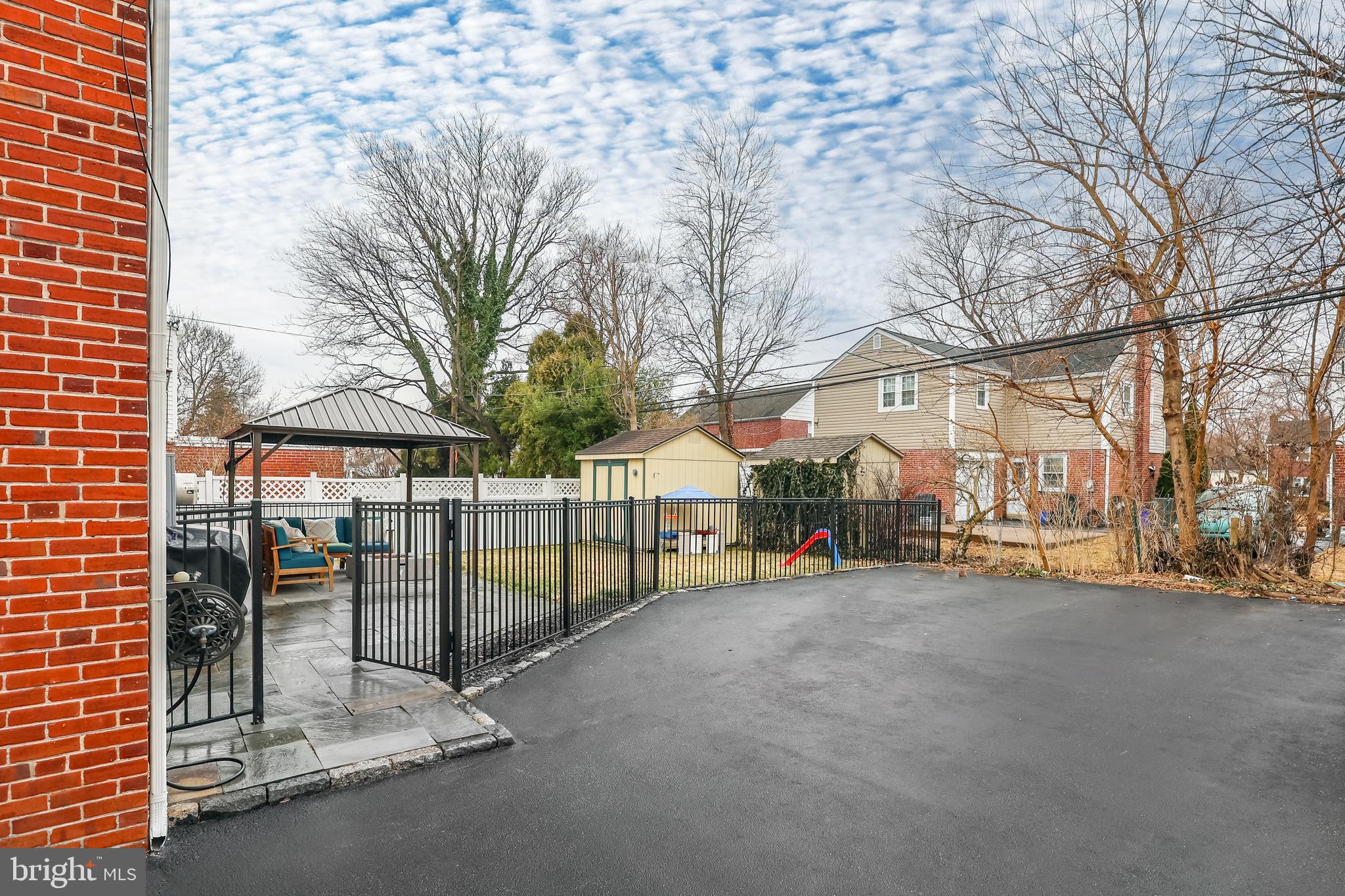 216 Earlington Road Havertown, PA 19083 - Photo 22 of 26 a view of a house with a big yard and large trees