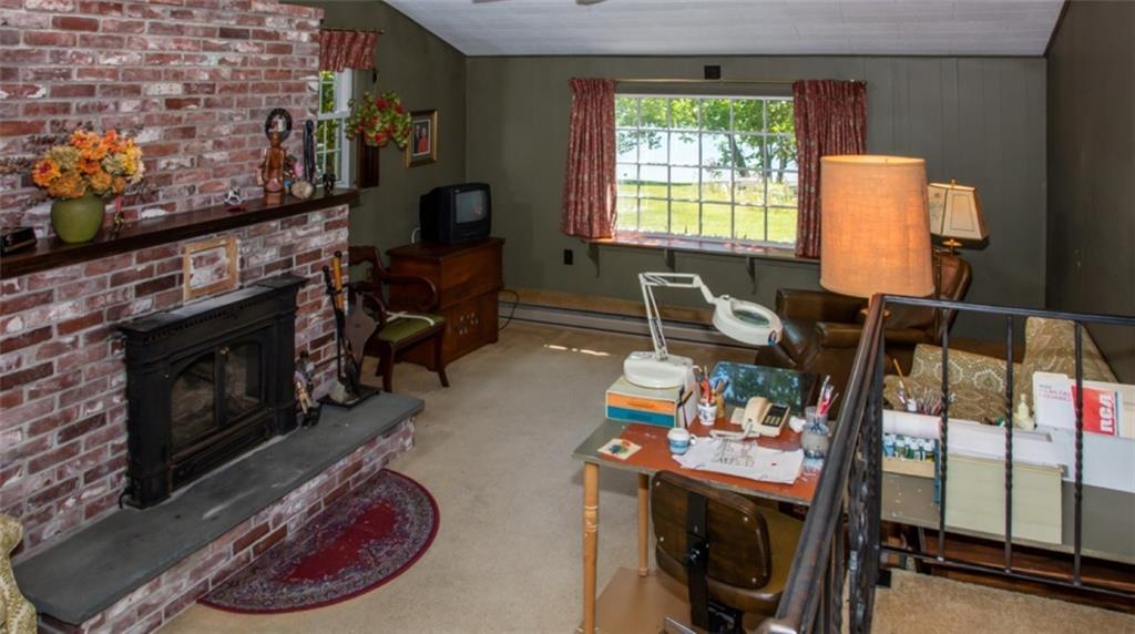 340 East Side Road Boothbay, ME 04571 - Photo 9 of 32 Den with fireplace and gas woodstove...