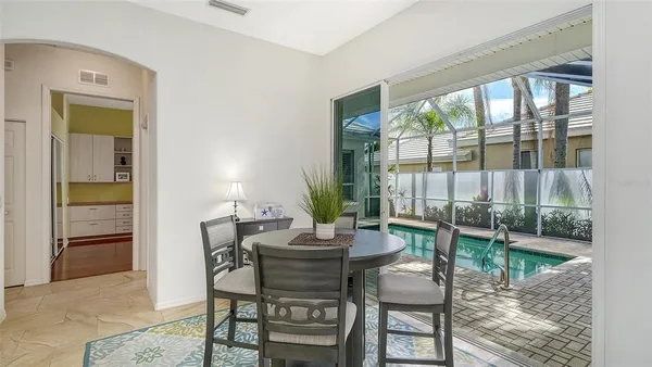 a spacious bathroom with a double vanity sink a large mirror and a shower