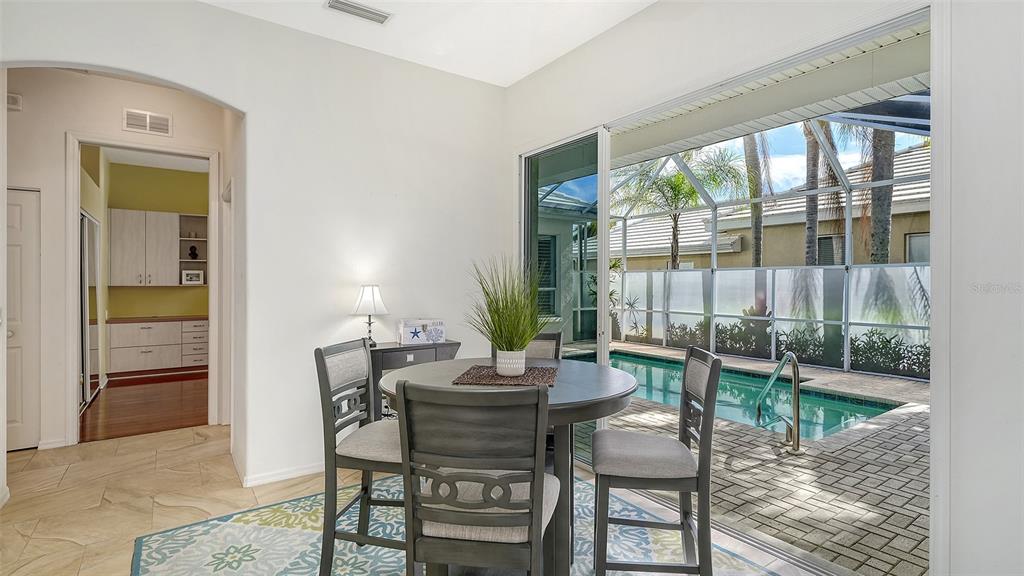 533 Fallbrook Drive Venice, FL 34292 - Photo 16 of 70 a dining room with furniture and wooden floor