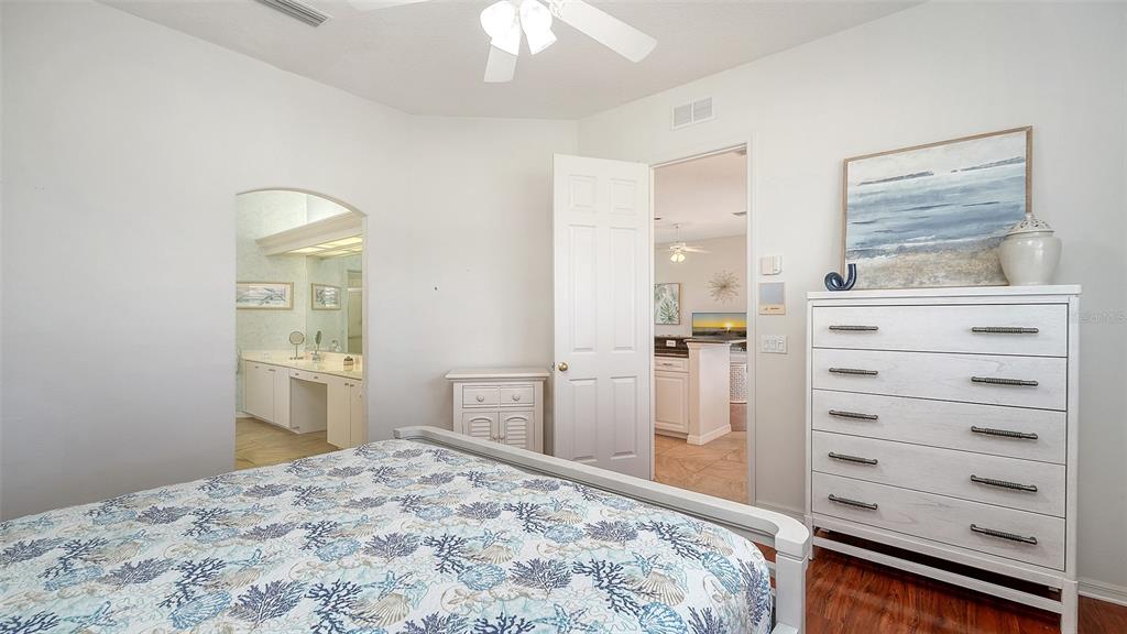 533 Fallbrook Drive Venice, FL 34292 - Photo 20 of 70 a bedroom with a bed and a dresser