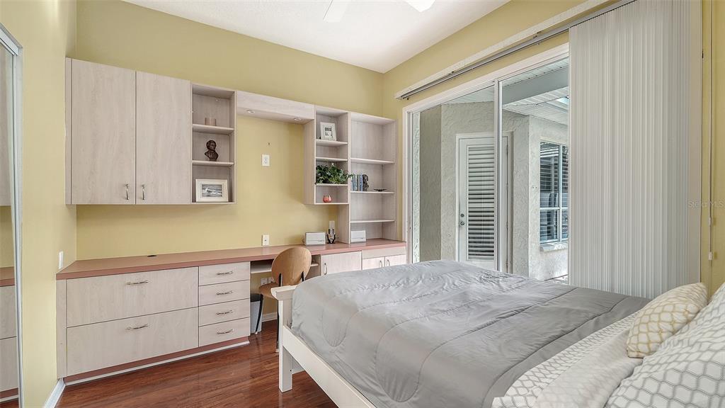 533 Fallbrook Drive Venice, FL 34292 - Photo 25 of 70 a bedroom with a bed and a cabinets