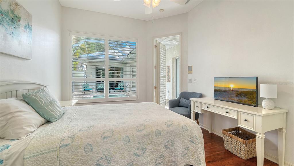 533 Fallbrook Drive Venice, FL 34292 - Photo 29 of 70 a bedroom with a bed and a flat screen tv