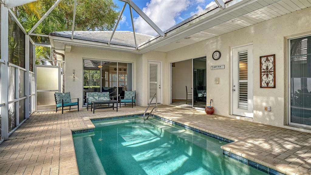 533 Fallbrook Drive Venice, FL 34292 - Photo 4 of 70 a view of a house with backyard porch and sitting area