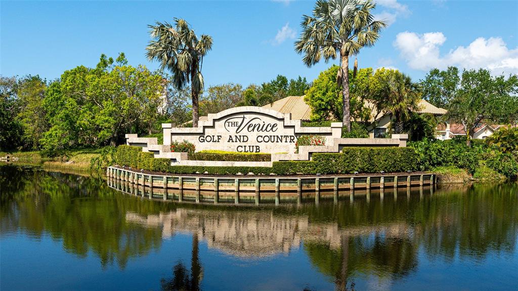 533 Fallbrook Drive Venice, FL 34292 - Photo 41 of 70 a view of a lake with a house in the background