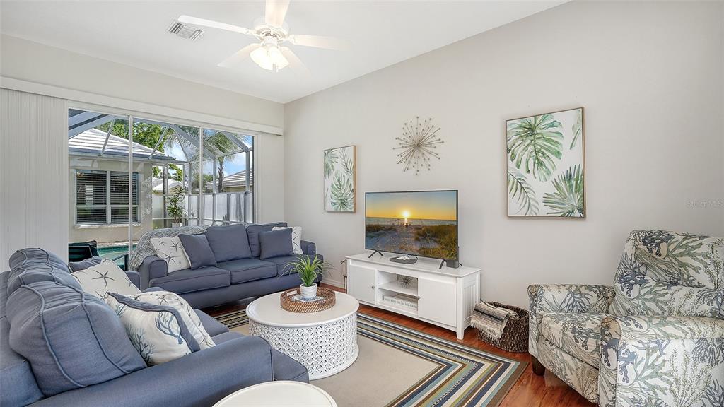 533 Fallbrook Drive Venice, FL 34292 - Photo 6 of 70 a living room with furniture and a flat screen tv