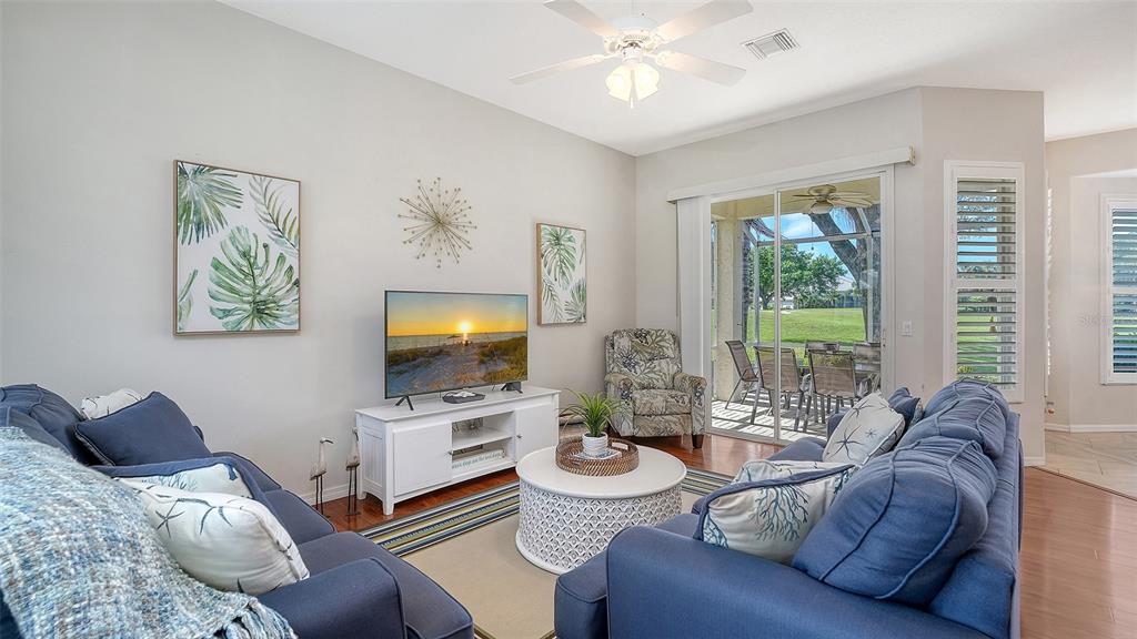 533 Fallbrook Drive Venice, FL 34292 - Photo 7 of 70 a living room with furniture and a flat screen tv