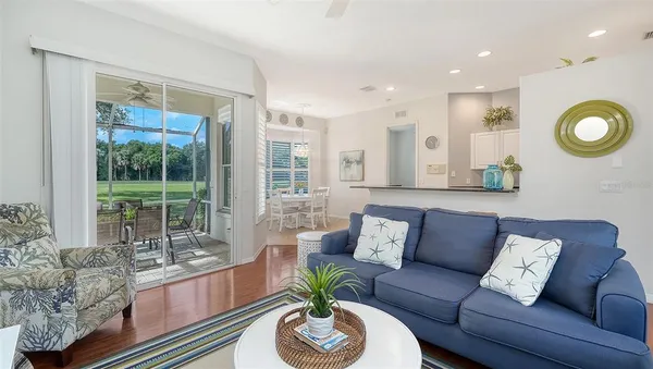 a dining room with furniture and window