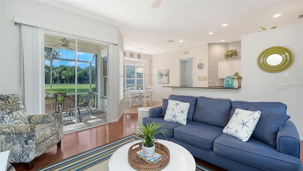 533 Fallbrook Drive Venice, FL 34292 - Photo 8 of 70 a living room with furniture and a large window