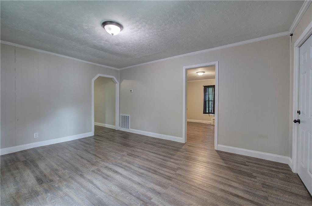 2014 Maple Avenue Southwest Rome, GA 30161 - Photo 3 of 22 a view of an empty room with wooden floor