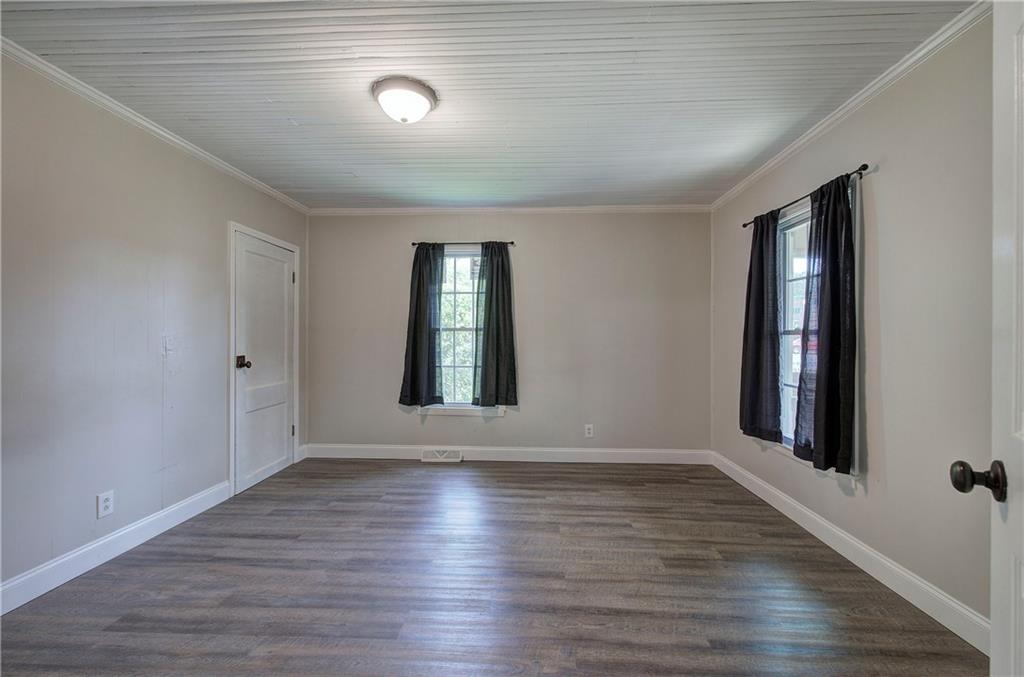 2014 Maple Avenue Southwest Rome, GA 30161 - Photo 5 of 22 a view of an empty room with wooden floor and a window