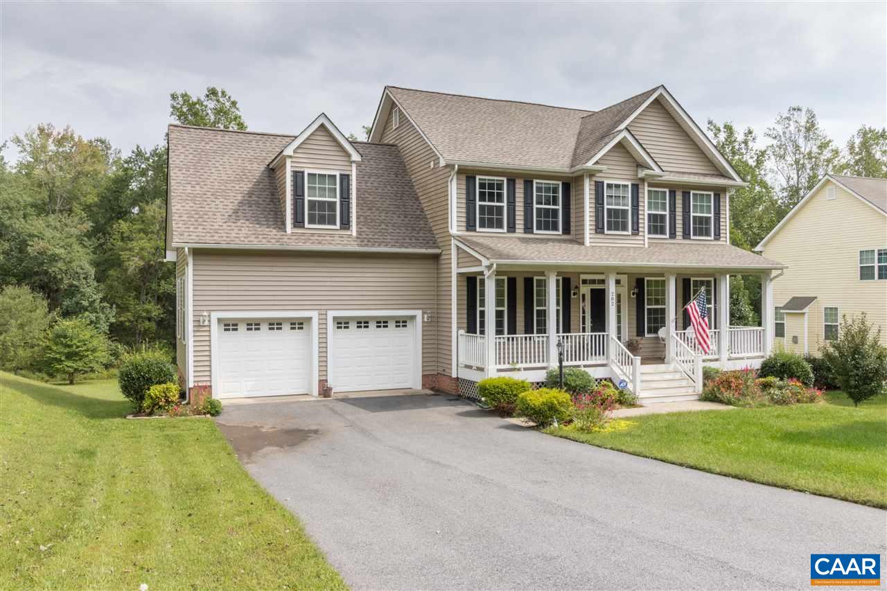 282 Lake Drive, Unit 2 Ruckersville, VA 22968 - Photo 1 of 27 a front view of a house with garden and porch