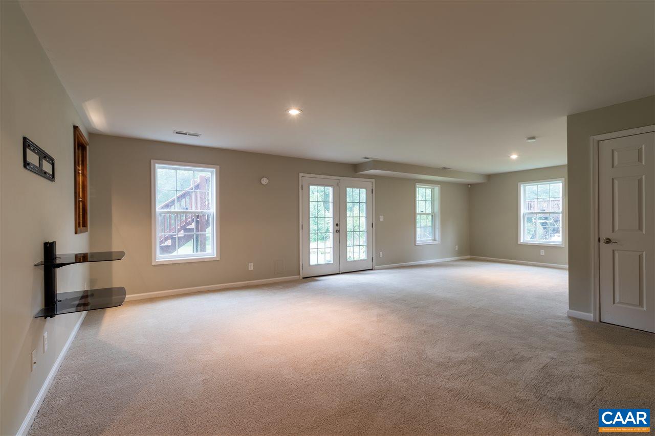 282 Lake Drive, Unit 2 Ruckersville, VA 22968 - Photo 13 of 27 a view of empty room with a window