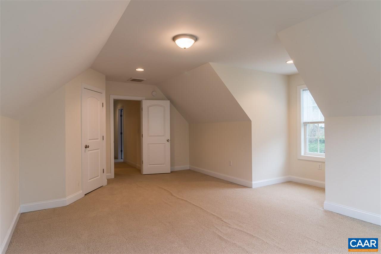 282 Lake Drive, Unit 2 Ruckersville, VA 22968 - Photo 16 of 27 wooden floor in an empty room with a window