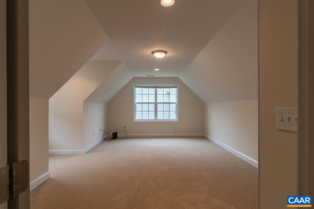 282 Lake Drive, Unit 2 Ruckersville, VA 22968 - Photo 17 of 27 a view of a big room with windows and chandelier fan