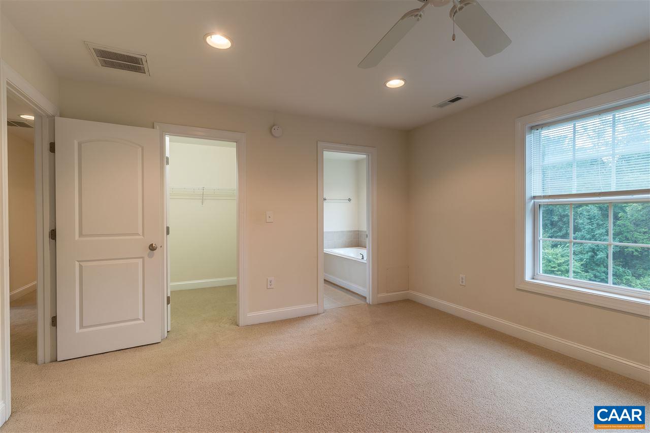 282 Lake Drive, Unit 2 Ruckersville, VA 22968 - Photo 19 of 27 an empty room with windows and closet