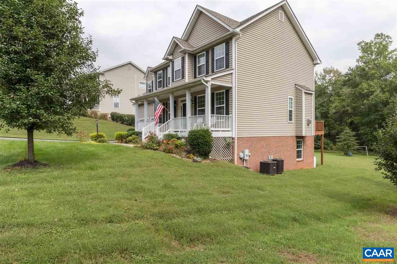 282 Lake Drive, Unit 2 Ruckersville, VA 22968 - Photo 26 of 27 a view of a house with a yard