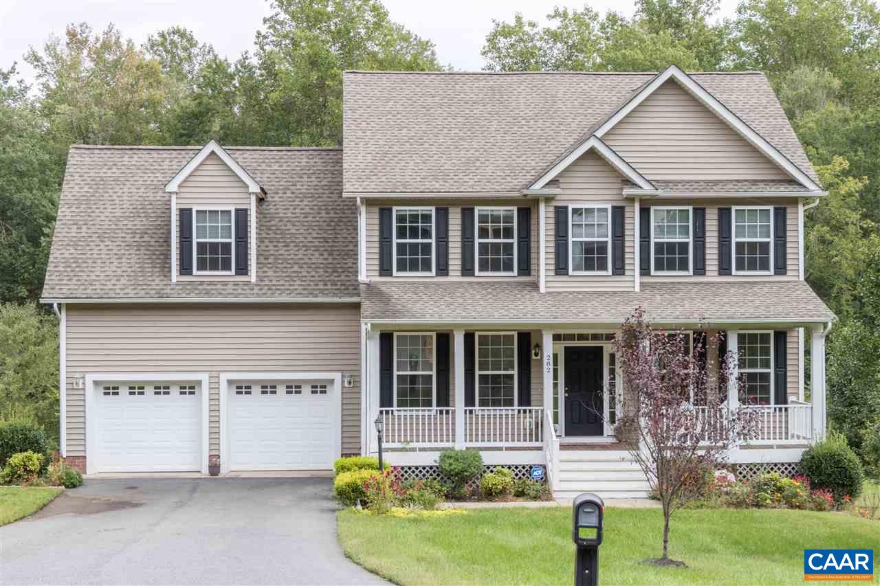 282 Lake Drive, Unit 2 Ruckersville, VA 22968 - Photo 27 of 27 a front view of a house with a yard