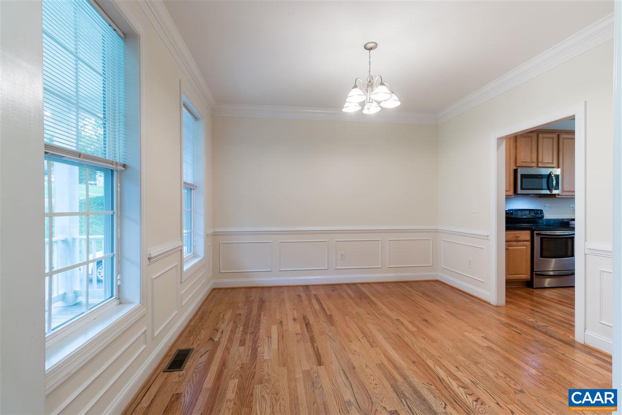 282 Lake Drive, Unit 2 Ruckersville, VA 22968 - Photo 8 of 27 wooden floor in an empty room with a window