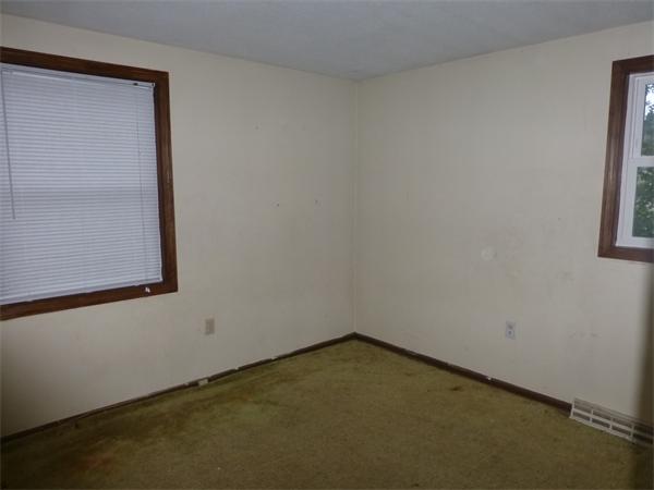 57-59 Howes Street Springfield, MA 01118 - Photo 11 of 14 an empty room with windows