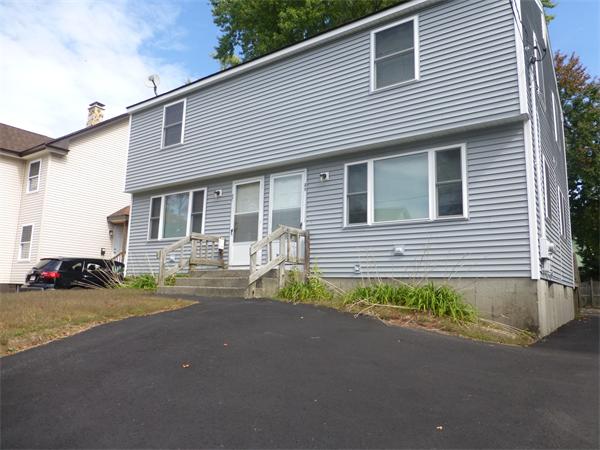 57-59 Howes Street Springfield, MA 01118 - Photo 2 of 14 a view of a house with a patio