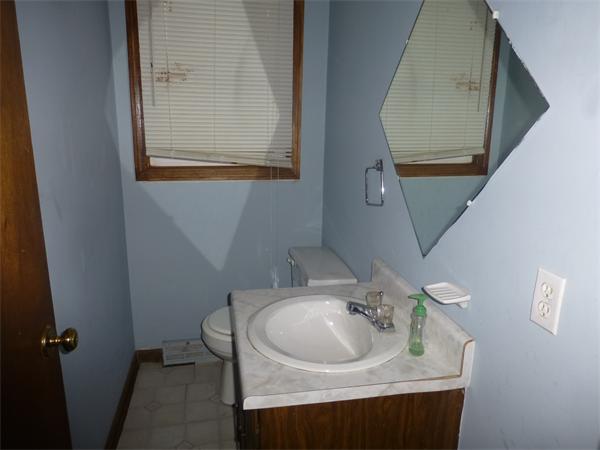 57-59 Howes Street Springfield, MA 01118 - Photo 7 of 14 a bathroom with a sink and a mirror