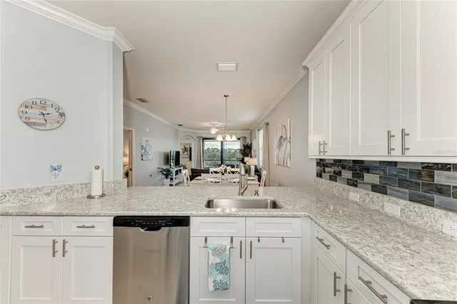 a kitchen with sink cabinets and stove