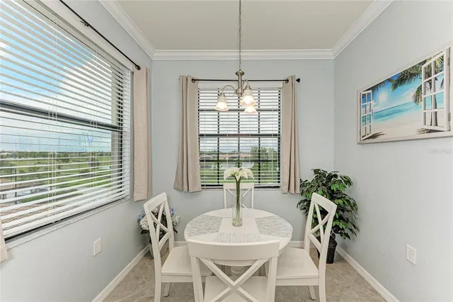 a dining room with furniture and window