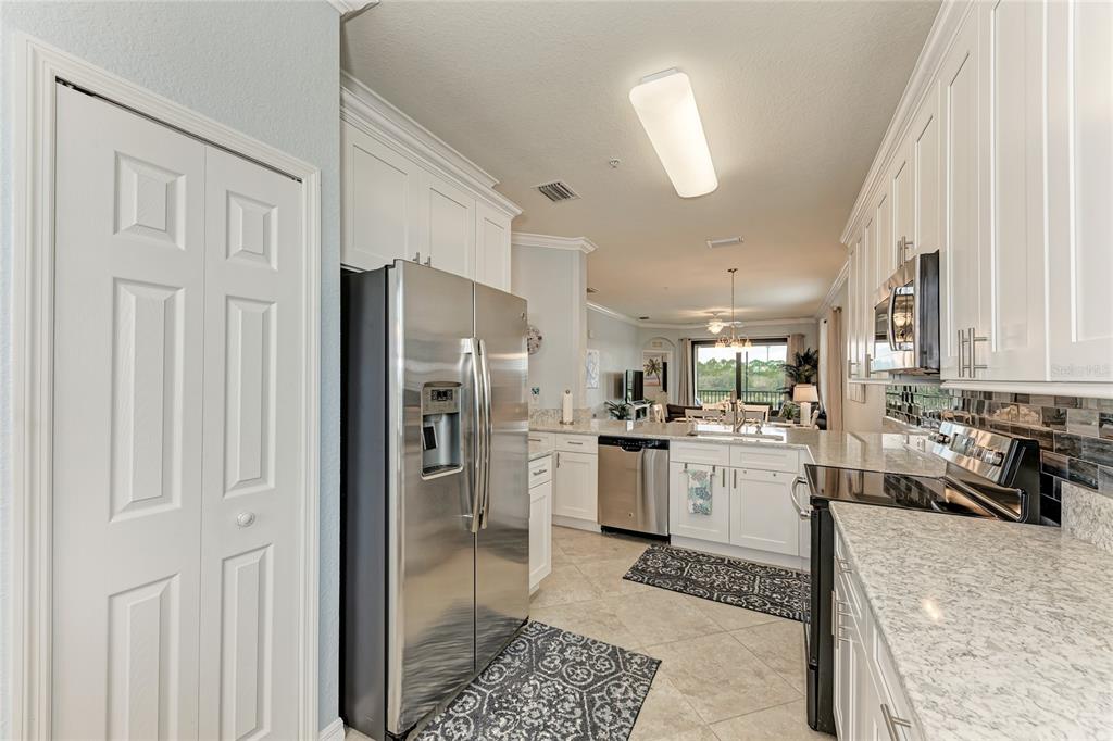 16804 Vardon Terrace, Unit 308 Bradenton, FL 34211 - Photo 19 of 43 a kitchen with refrigerator and window