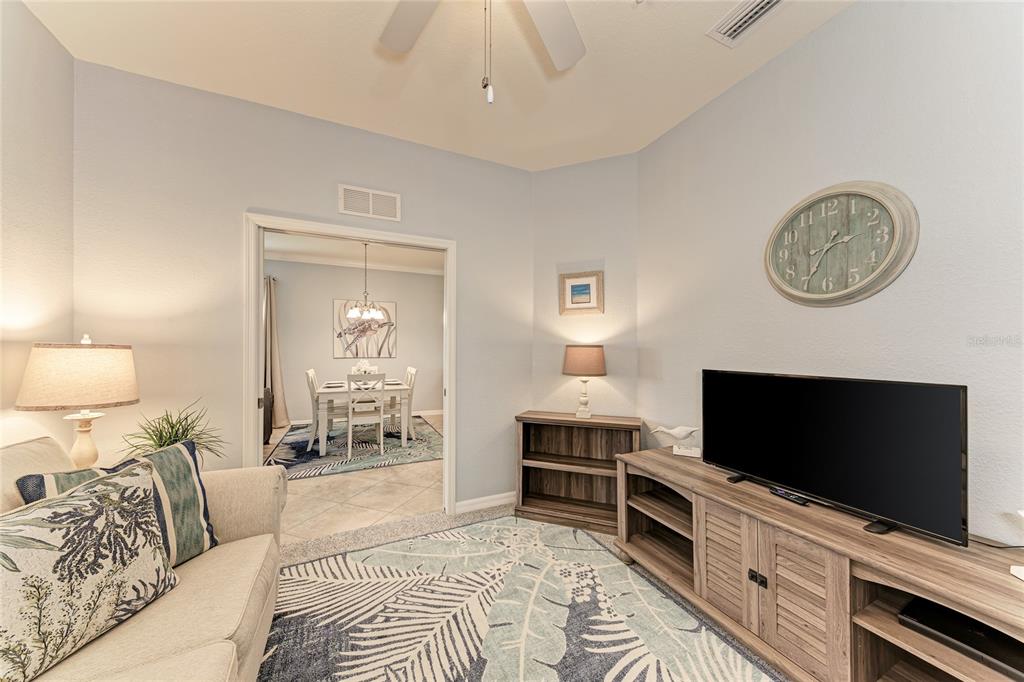 16804 Vardon Terrace, Unit 308 Bradenton, FL 34211 - Photo 26 of 43 a bedroom with a bed and a flat screen tv