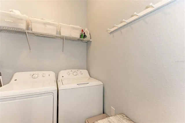 a utility room with dryer and washer