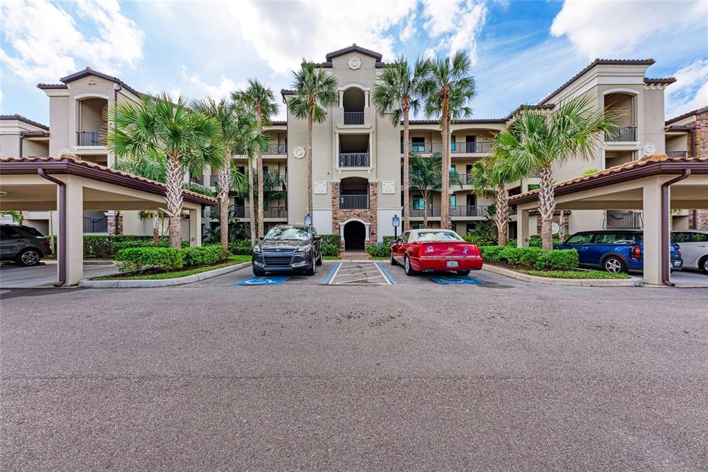 16804 Vardon Terrace, Unit 308 Bradenton, FL 34211 - Photo 3 of 43 a front view of building with cars parked