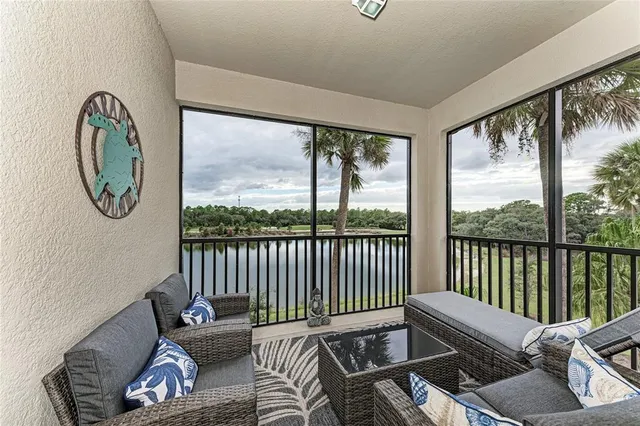 a balcony with furniture and a window