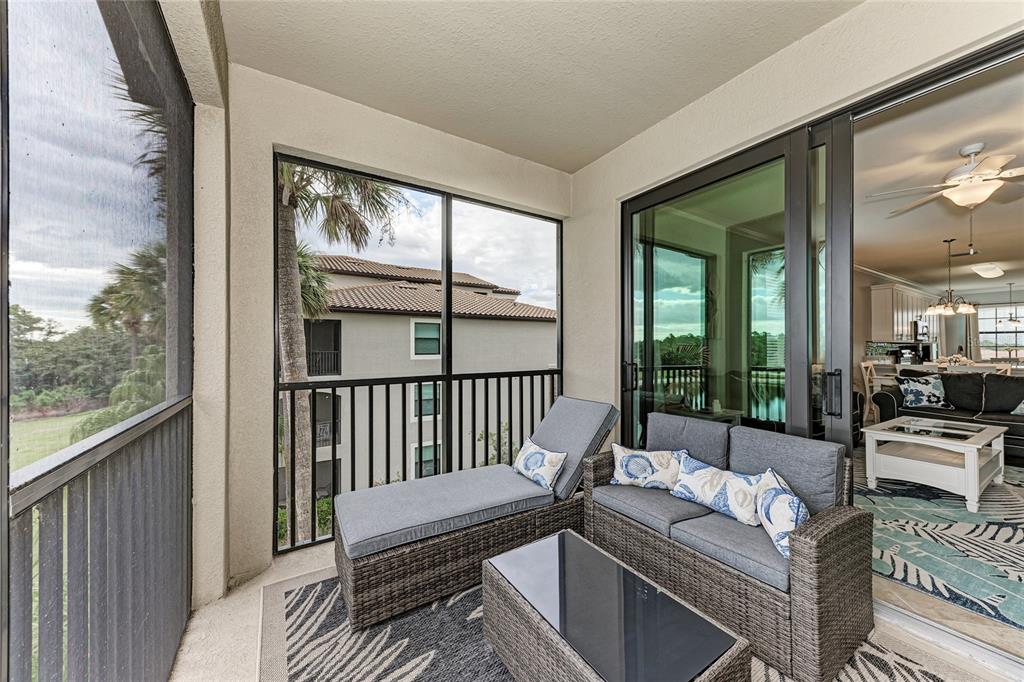 16804 Vardon Terrace, Unit 308 Bradenton, FL 34211 - Photo 32 of 43 a balcony with furniture and a potted plant