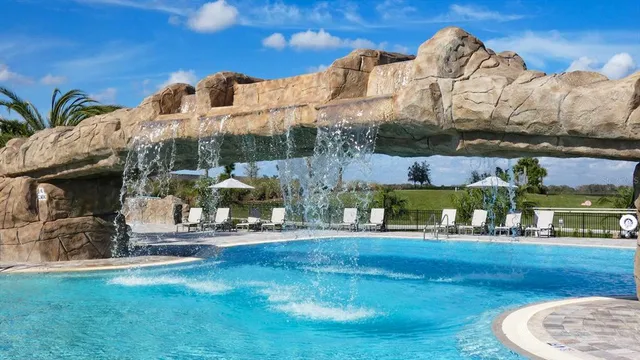 a front view of building with yard