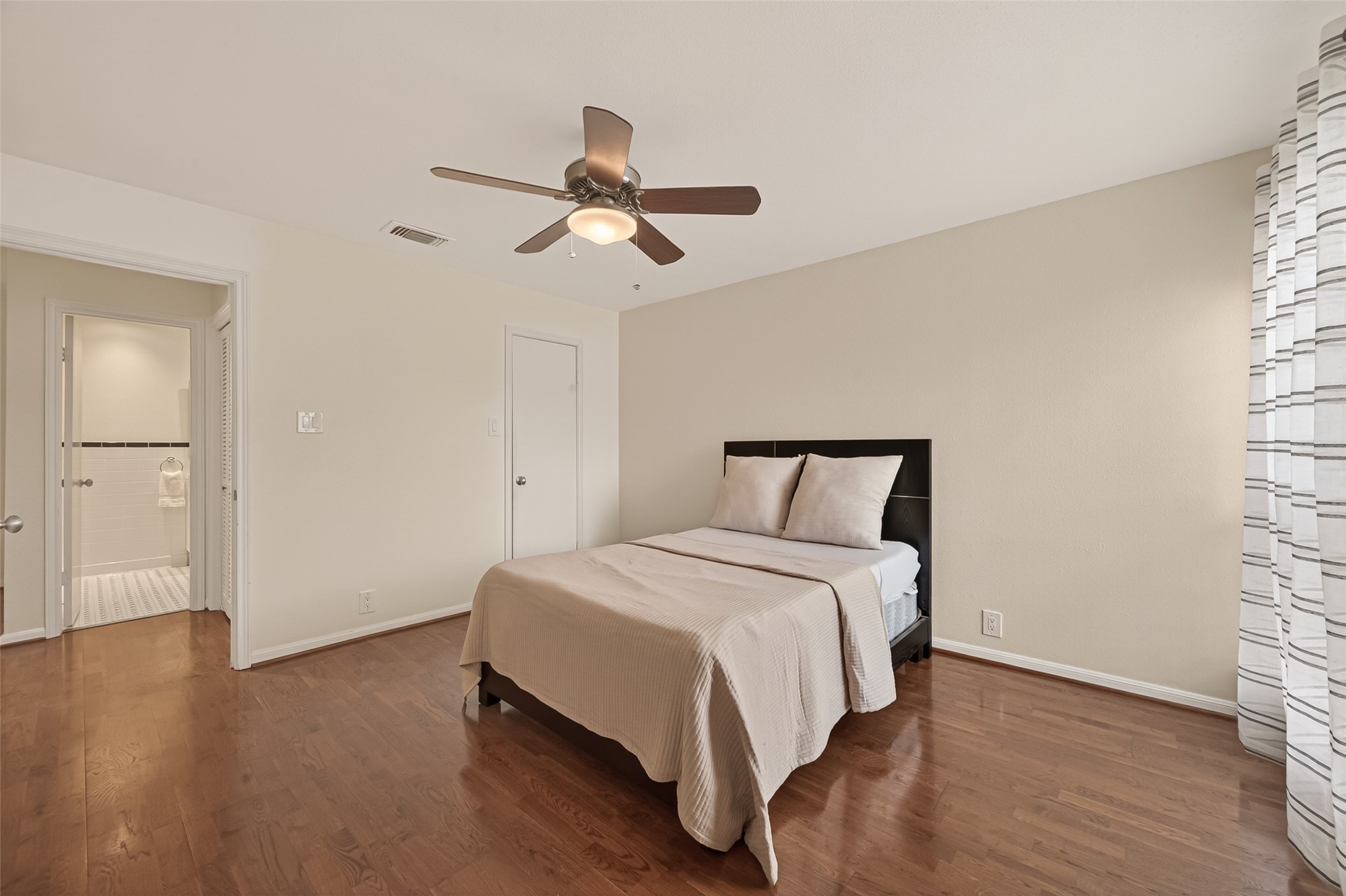 2829 Timmons Lane, Unit 144 Houston, TX 77027 - Photo 16 of 41 Discover the perfect blend of comfort and style in this inviting bedroom, featuring a spacious walk-in closet for all your storage needs.