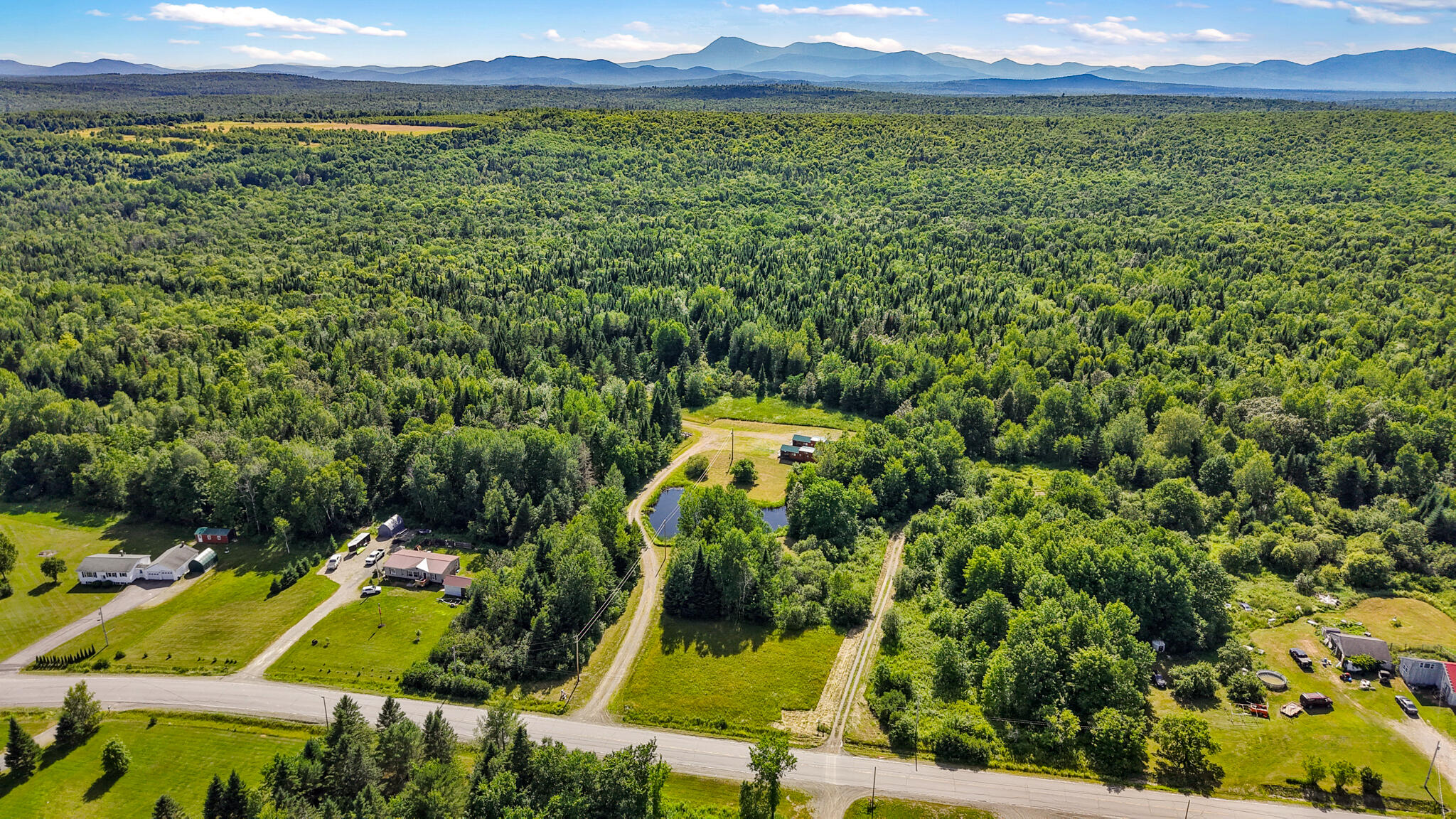824 Shin Pond Road Patten, ME 04765 - Photo 14 of 49 dji_fly_20260712_155504_0858_17838862540
