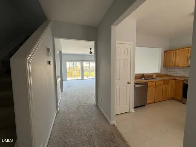 a view of a kitchen with a sink stove and refrigerator
