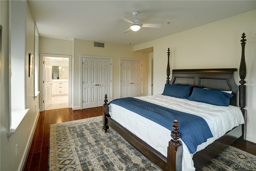 413 Stuart Circle, Unit 4C Richmond, VA 23220 - Photo 13 of 27 a bedroom with a bed and wooden floor