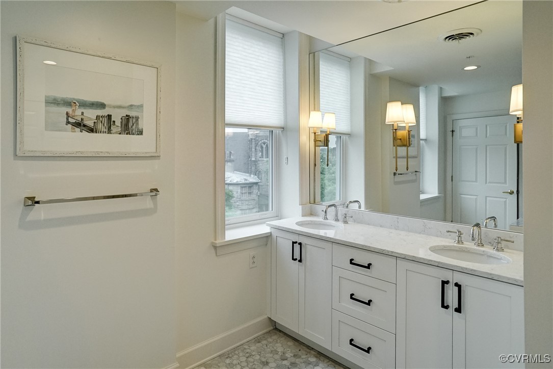 413 Stuart Circle, Unit 4C Richmond, VA 23220 - Photo 14 of 27 a bathroom with a granite countertop sink mirror and a