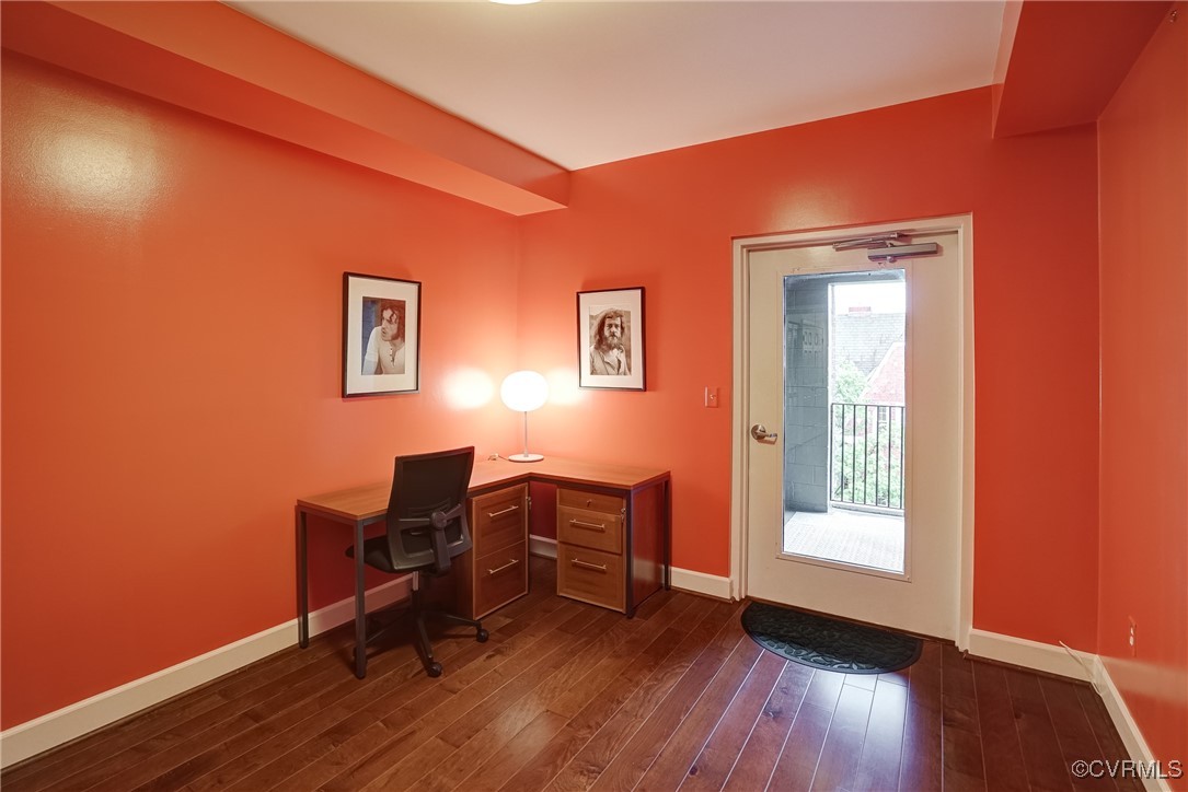 413 Stuart Circle, Unit 4C Richmond, VA 23220 - Photo 17 of 27 a view of a workspace with wooden floor and a window