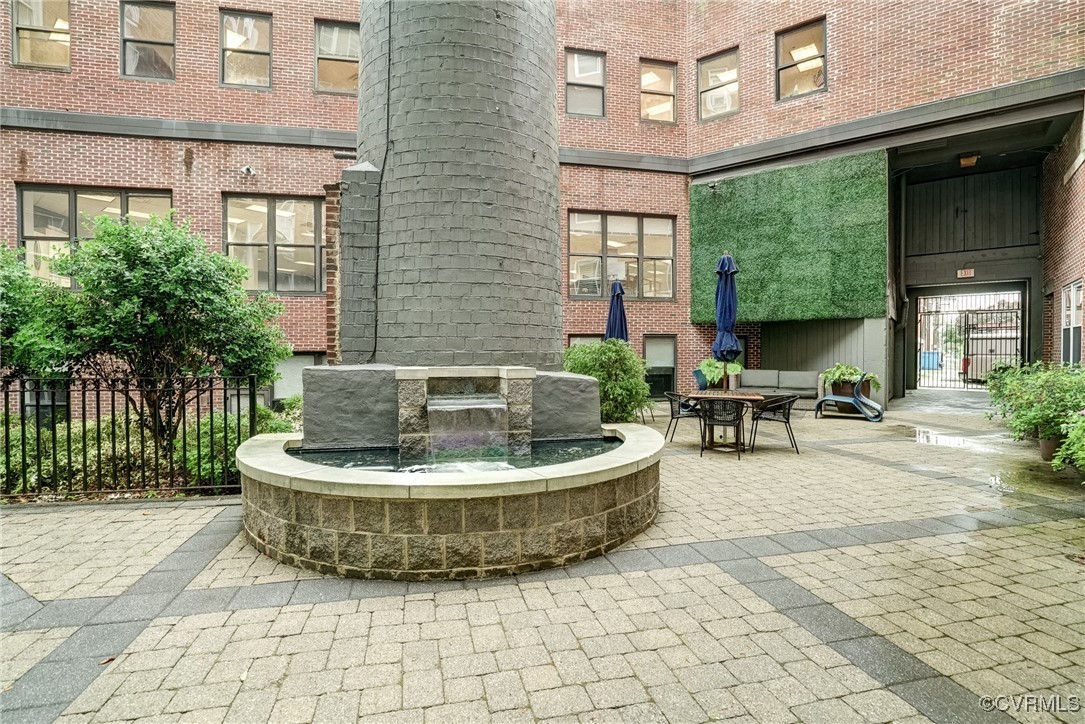 413 Stuart Circle, Unit 4C Richmond, VA 23220 - Photo 24 of 27 a view of a patio with a chairs and plants