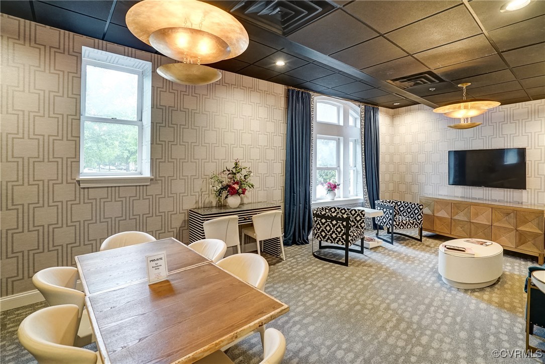 413 Stuart Circle, Unit 4C Richmond, VA 23220 - Photo 26 of 27 a living room with furniture and a flat screen tv