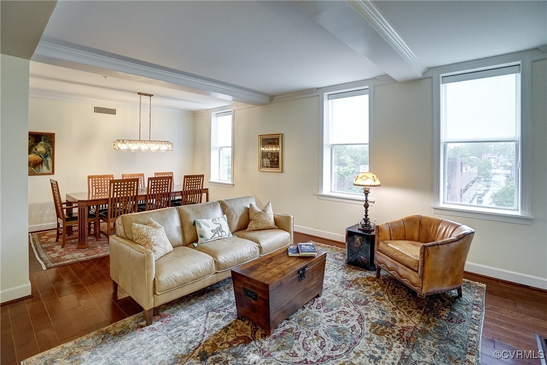 413 Stuart Circle, Unit 4C Richmond, VA 23220 - Photo 27 of 27 a living room with furniture and a potted plant