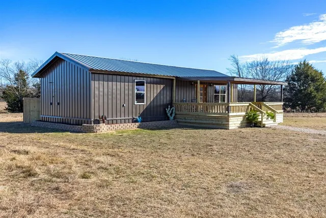 a view of a lake with an outdoor seating