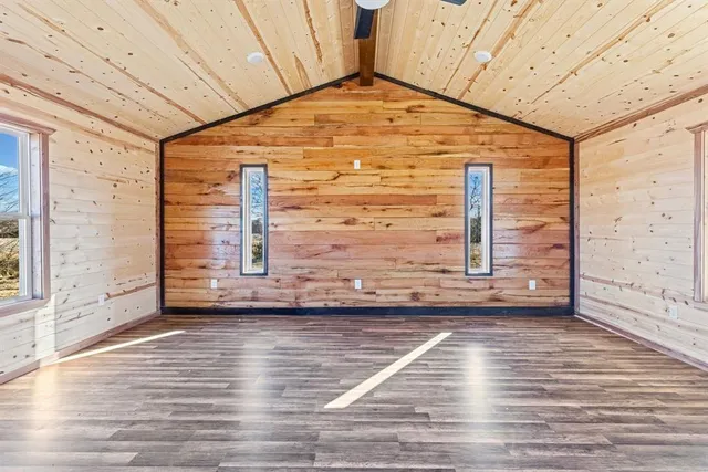 a view of an entryway with wooden floor