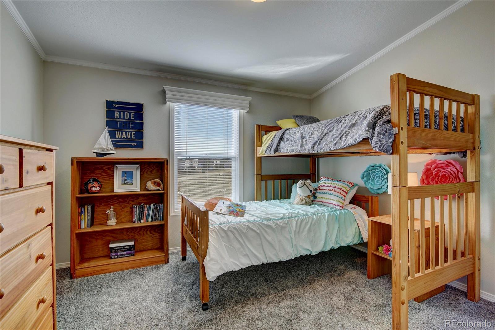 125 12th Street Fairplay, CO 80440 - Photo 12 of 17 a bedroom with a bed and a book shelf